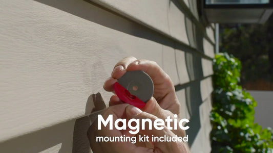 Person holding magnetic mount and preparing for installation 3